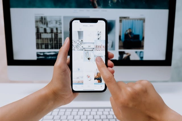 Person-browsing-digital-content-on -smartphone-illustrating-online-visibility-and-business-growth-strategies.